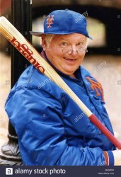 benny-hill-actor-comedian-in-a-baseball-outfit-holding-a-baseball-B4G3PG.jpg
