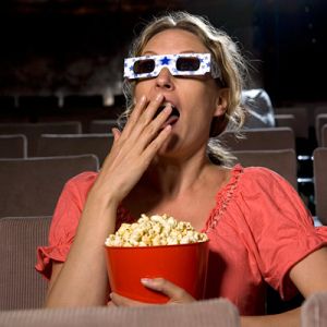 Woman-eating-popcorn-at-movies